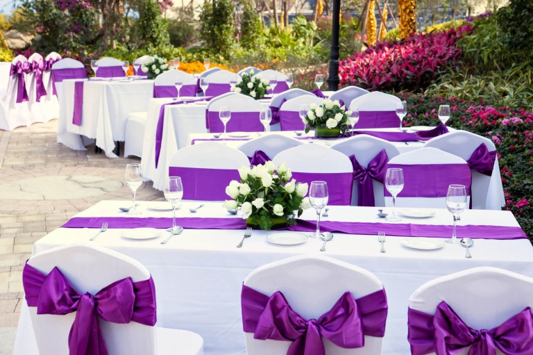outdoor tables with served plate and wine glasses